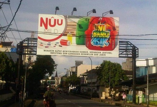 An advertisement for Nuu Mild cigarettes in Ambon, 2012, openly targeting children. Photo by Tim Mann.